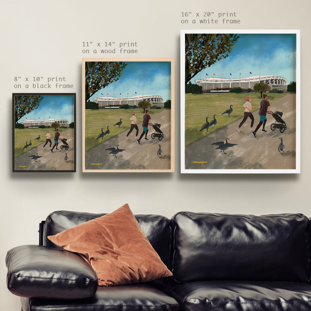 a living room with a couch and two paintings on the wall