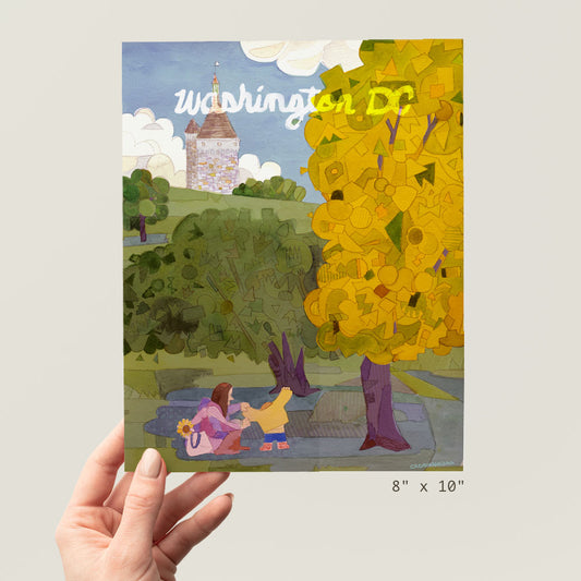 a person holding up a picture of a tree