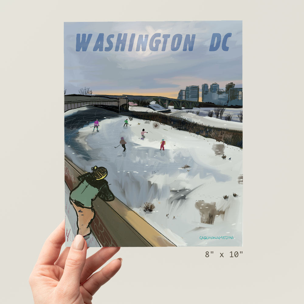 a person holding up a poster with a picture of people playing in the snow