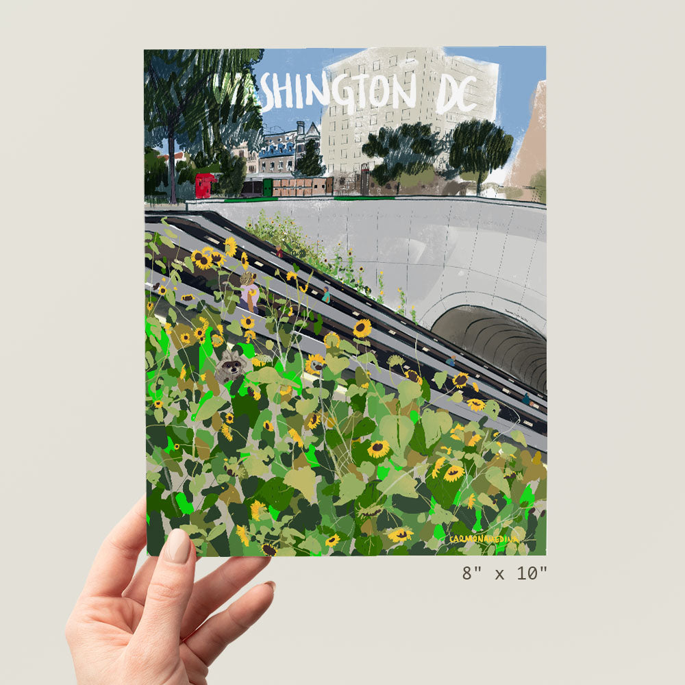 a person holding up a picture of a flower garden