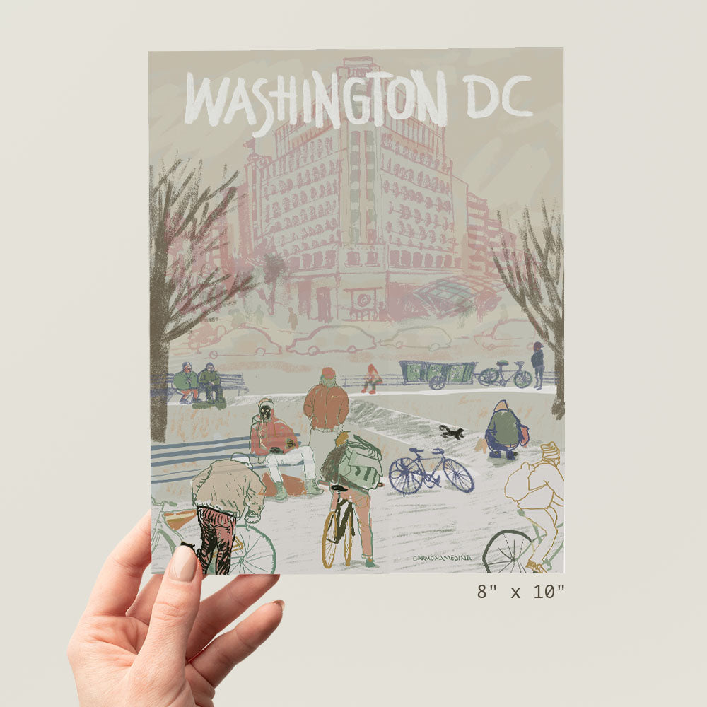 a person holding up a picture of washington dc