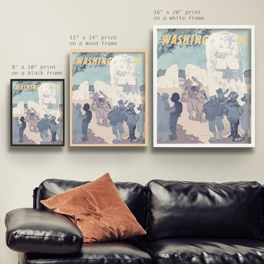 a living room with a couch and two posters on the wall