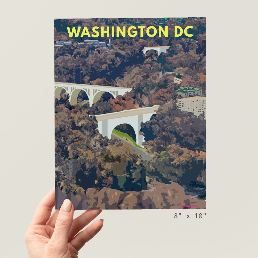 a person holding up a picture of a bridge