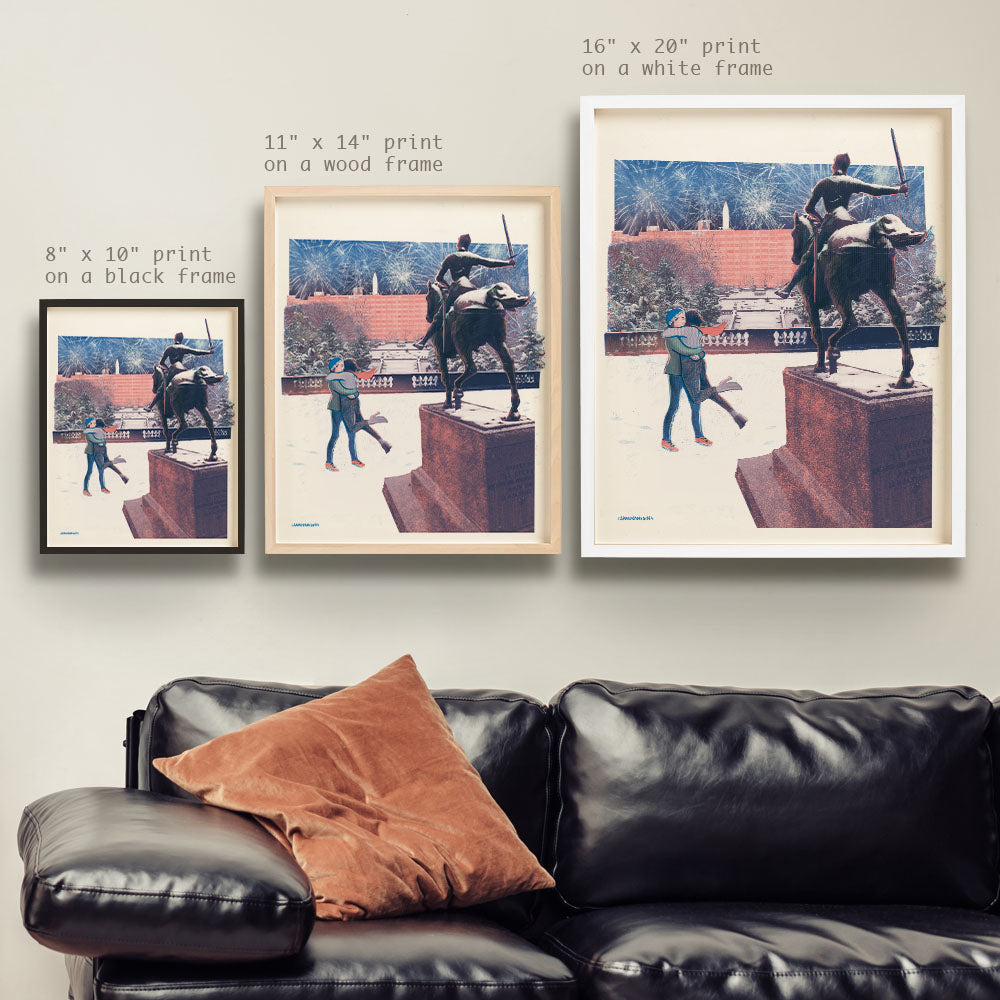 a living room with a couch and two pictures on the wall