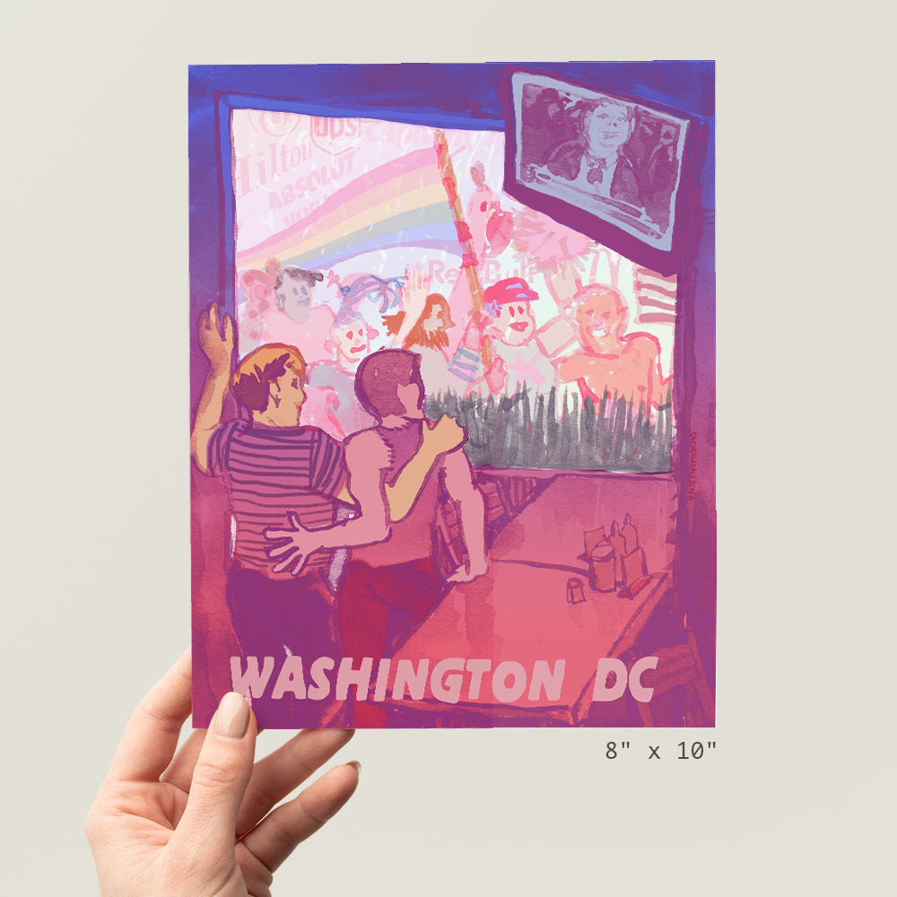 a person holding up a picture of washington dc